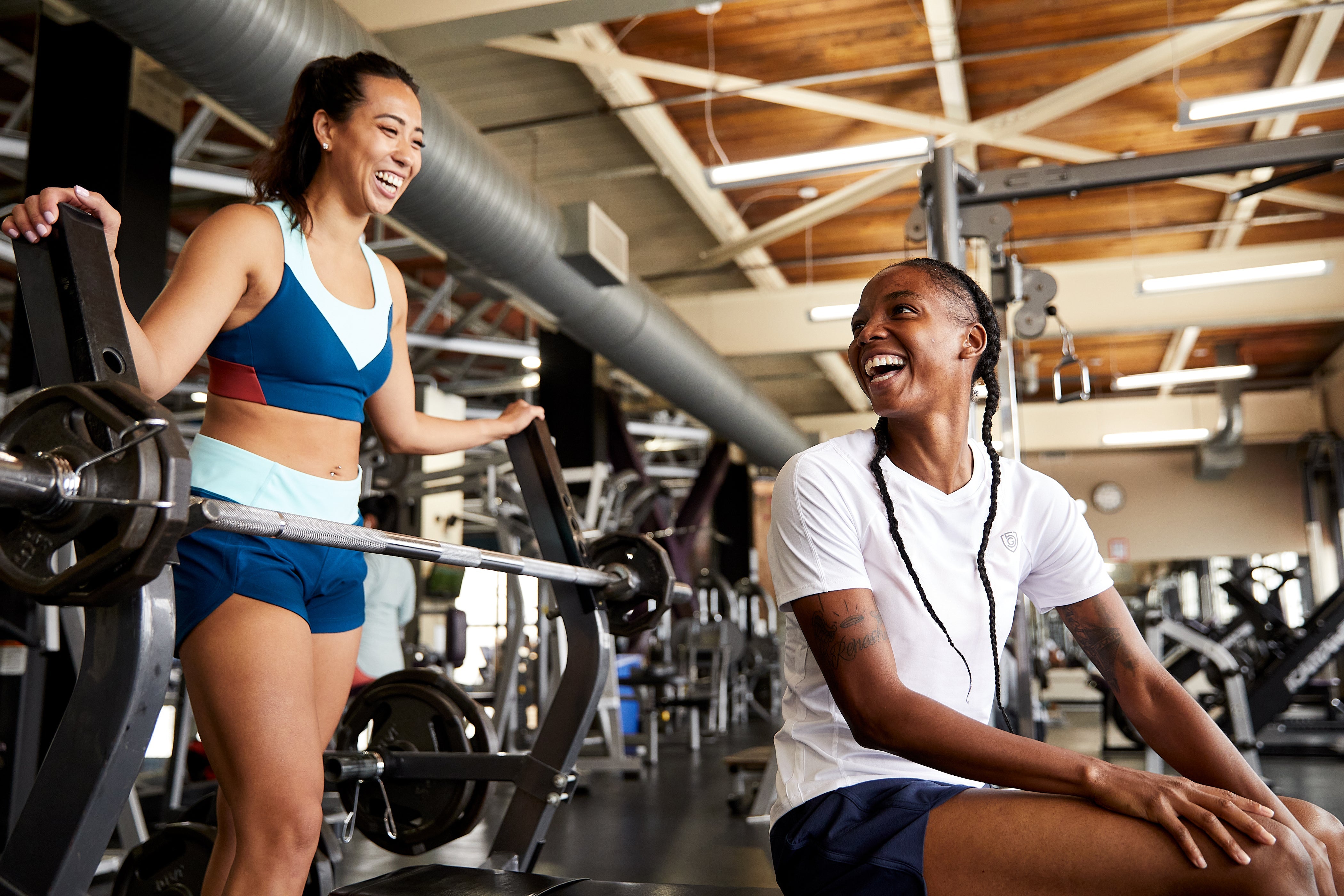 Women workout and socialize in Goal Five women's athletic tops. 