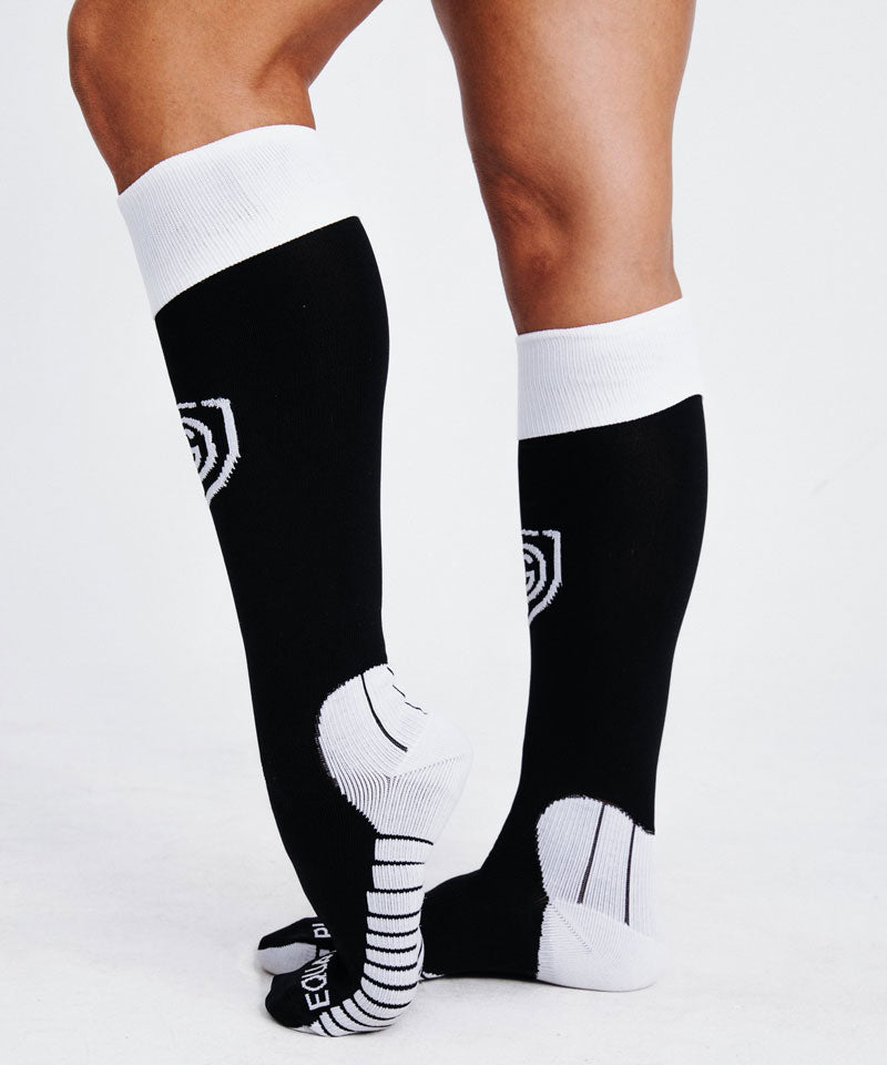 A model shows the comfortable fit of the Equal Play OTC socks.