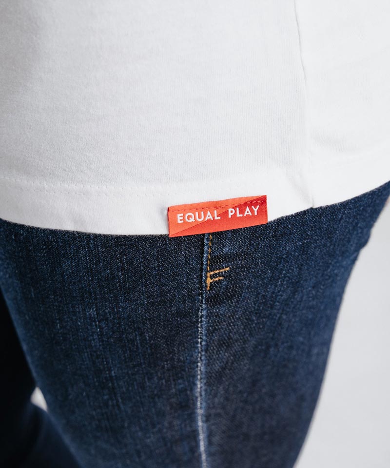 The Equal Play label on our women's soccer t-shirt is featured.