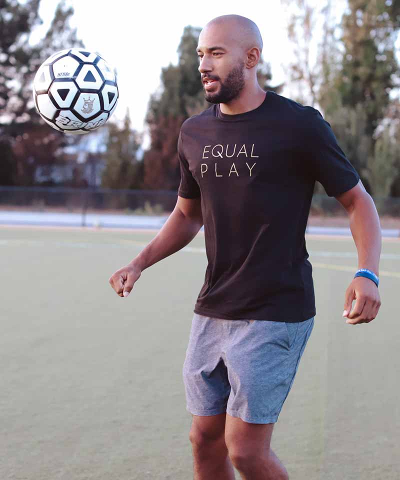 A man practices in the Equal Play T-Shirt.